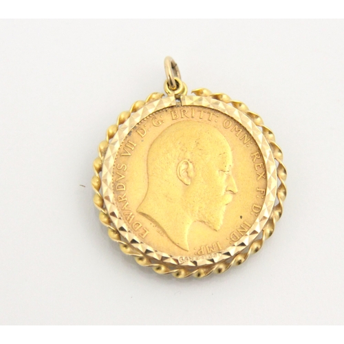 121 - An Edward VII full sovereign, dated 1903, within a yellow metal pendant mount with rope twist detail... 