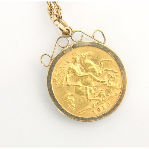122 - An Edwardian half sovereign, dated 1910, within a 9ct yellow gold mount, upon an associated yellow m... 