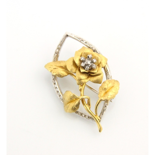 129 - A yellow metal and diamond set brooch, the marquise white metal diamond set sides with diamond set s... 