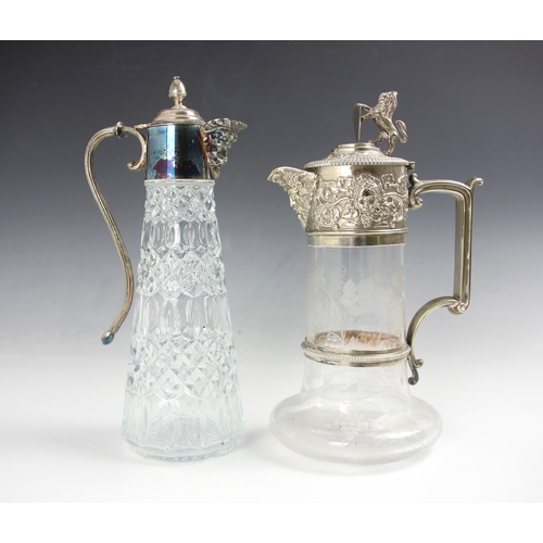 13 - A silver plated and glass claret jug, the silver plate mount embossed with bacchanalian decoration, ... 