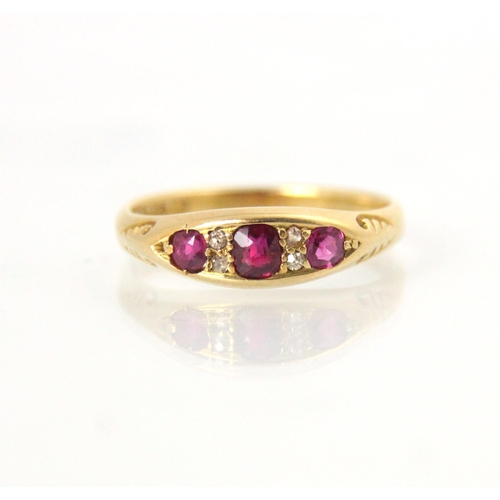 132 - An Edwardian untested ruby and diamond ring, the central  cushion cut red stone with a smaller round... 