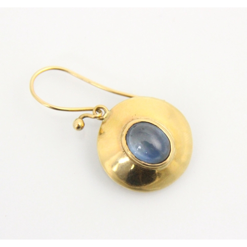 133 - A pair of yellow metal and untested sapphire earrings, the central oval cabochon within a yellow gol... 