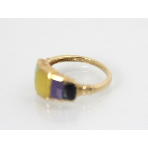 135 - A yellow metal multi coloured hardstone dress ring, the five stepped rectangular hardstones includin... 