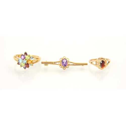 145 - A selection of jewellery, to include a 9ct yellow gold multi gem dress ring, designed as a flower he... 