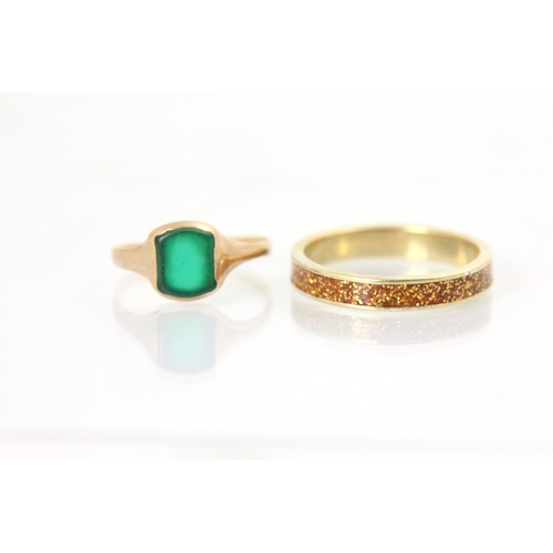 149 - A 9ct yellow gold untested chrysoprase signet ring, the rectangular head within yellow gold rub over... 