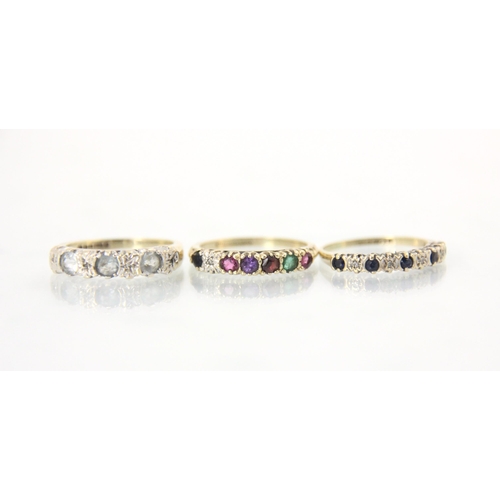 161 - A late 20th century 'regards' ring, the multi coloured stone ring set to carved 9ct yellow gold shou... 
