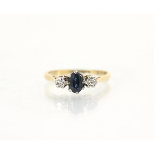 162 - An Edwardian style untested sapphire and diamond three stone ring, the central oval cut blue stone w... 