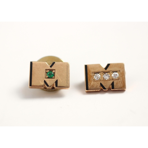169 - A pair of of untested emerald set yellow gold gentlemen's dress studs, the 'M' shaped studs with bla... 