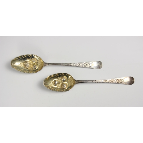 24 - A pair of late 19th century silver berry spoons, indistinctly stamped, makers mark possibly ‘WF’ the... 