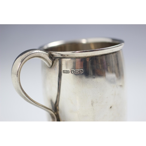 30 - A silver mug, James Dixon and Sons, Sheffield 1947, the slightly flared rim above plain polished bar... 