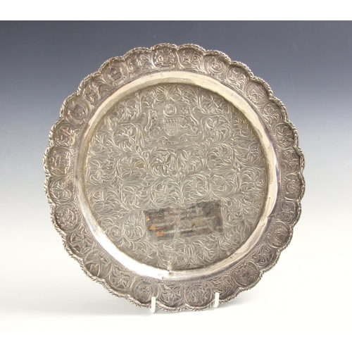 37 - ROYAL INTEREST: A silver coloured presentation salver, the shaped rim with circular embossed cartouc... 