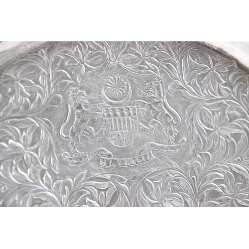 37 - ROYAL INTEREST: A silver coloured presentation salver, the shaped rim with circular embossed cartouc... 
