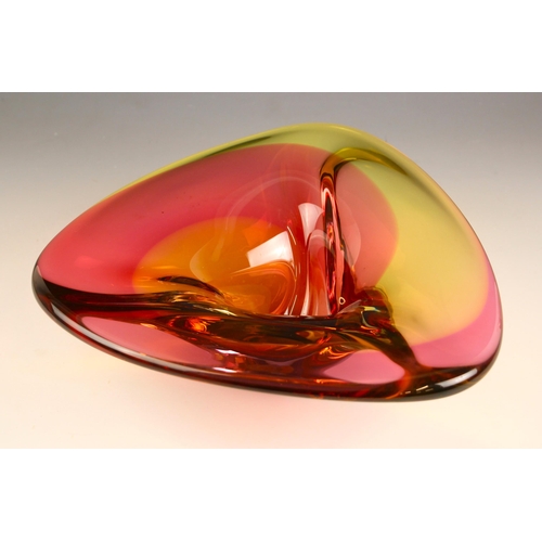 615 - A Studio Glashyttan Ahus glass bowl, of stylised triangular form, the body in a pink, yellow and ora... 