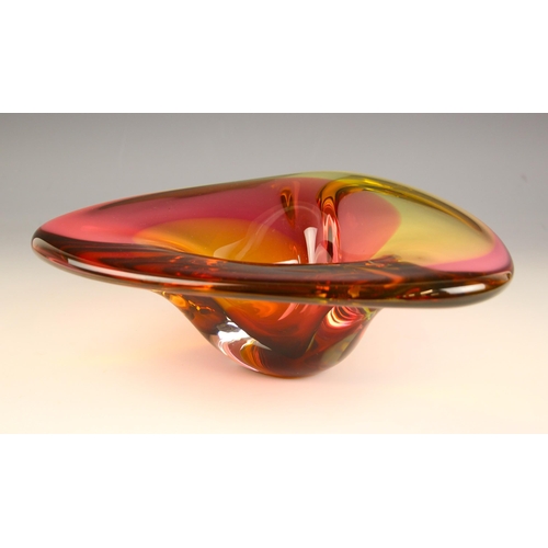 615 - A Studio Glashyttan Ahus glass bowl, of stylised triangular form, the body in a pink, yellow and ora... 