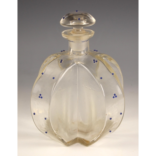 616 - A glass cruciform decanter and stopper, late 19th/ early 20th century, the body decorated with prunt... 