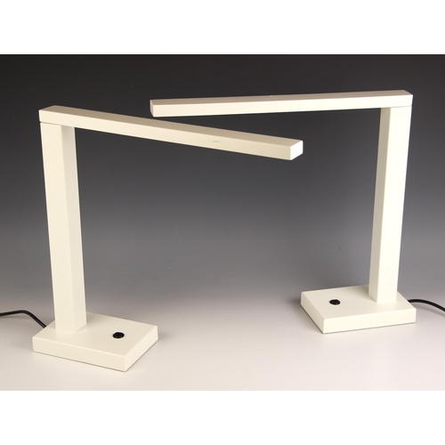 634 - A pair of Chelsom 'Motion' steel desk lamps, with adjustable arm, matt white finish, with applied ma... 