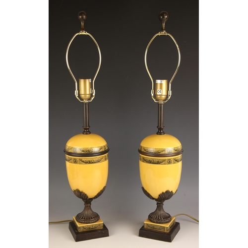 635 - A pair of Theodore Alexander lamp bases, each of shouldered ovoid form with brass band, decorated wi... 