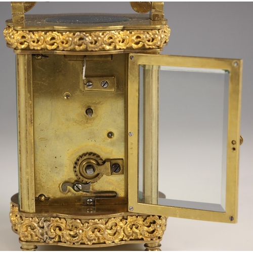 730 - A French eight day brass cased carriage timepiece, late 19th century, the case of serpentine form ap... 