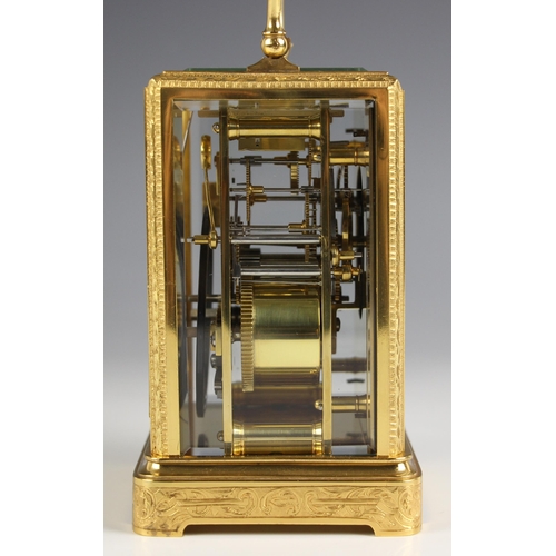 736 - A brass cased two train carriage clock, late 19th century, the profusely engraved case and bevelled ... 