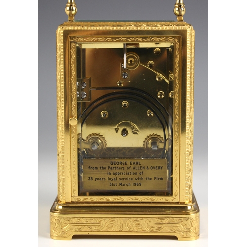 736 - A brass cased two train carriage clock, late 19th century, the profusely engraved case and bevelled ... 