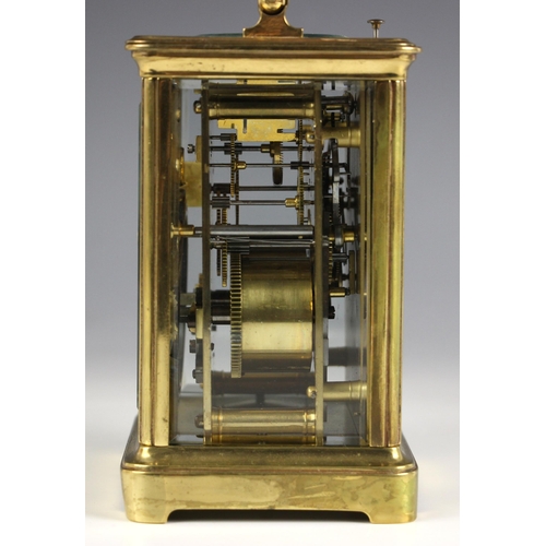 738 - A brass cased two train repeating carriage clock, late 19th century, the 7cm enamel dial with engine... 