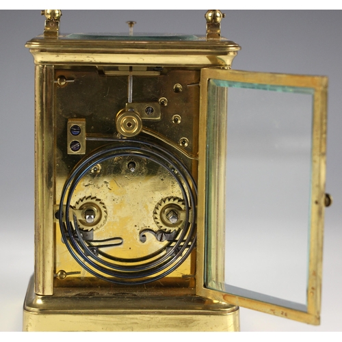 738 - A brass cased two train repeating carriage clock, late 19th century, the 7cm enamel dial with engine... 