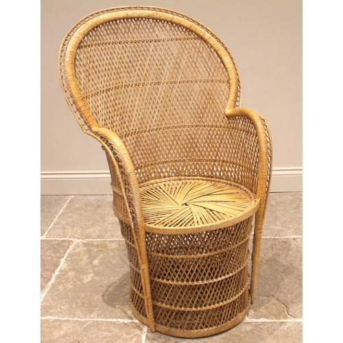 837 - A 1970's wicker peacock chair, the arched fan back over a radiating woven drum shaped seat, 102cm H,... 