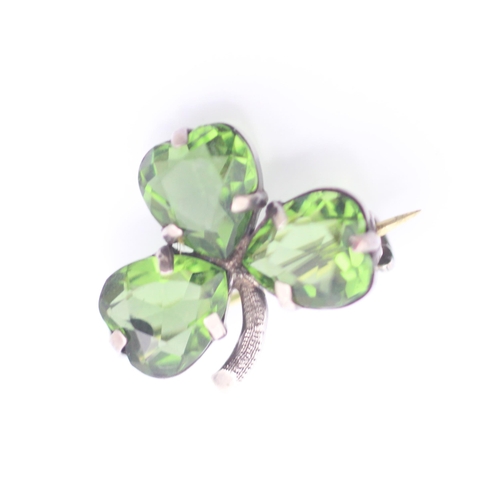 86 - A group of three Charles Horner pieces of jewellery, to include a green paste set three leaf clover ... 