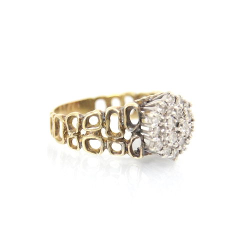 89 - An 18ct yellow gold diamond cluster ring, the raised diamond set cluster within claw set white metal... 