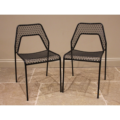 842 - A pair of Heals 'Blu-dot' mesh stacking chairs, each with an arched back rest upon slender tubular l... 