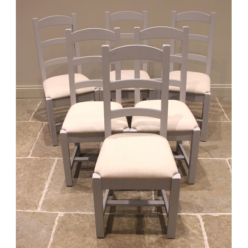 843 - A set of six contemporary painted ladder back chairs, each with three rungs over an upholstered seat... 