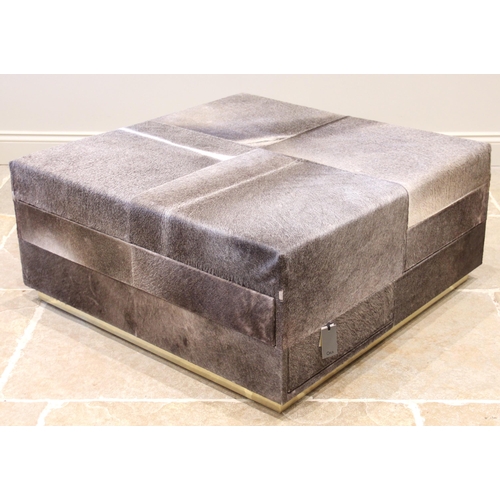 848 - An Oka Locke cow hide ottoman, of cubic form with padded seats above six suede lined drawers, upon a... 