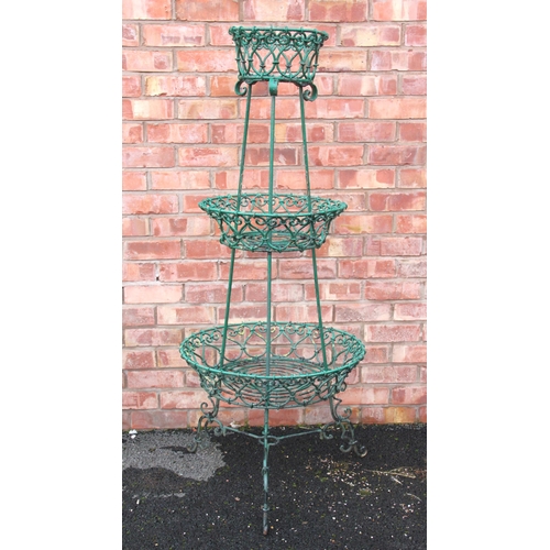 864 - A Victorian style three tier garden plant stand, early 20th century, of tapering circular form with ... 