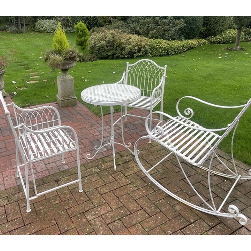 869 - A white painted wrought-iron alfresco breakfast set, comprising; a circular strapwork table with a g... 