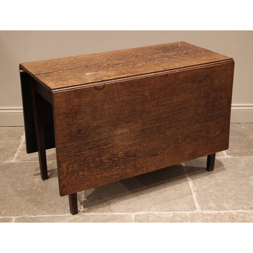 804 - A 19th century oak drop leaf table, the rectangular top upon legs of tapering square section, 70cm H... 