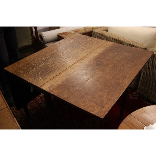 804 - A 19th century oak drop leaf table, the rectangular top upon legs of tapering square section, 70cm H... 