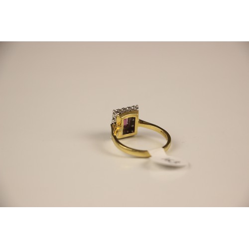 163 - An 18ct yellow gold untested almandine garnet and diamond cluster ring, the emerald cut red stone wi... 