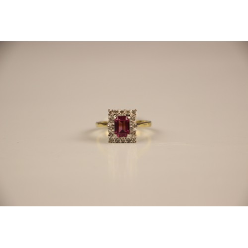 163 - An 18ct yellow gold untested almandine garnet and diamond cluster ring, the emerald cut red stone wi... 