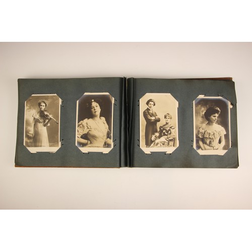 484 - A selection of five Victorian photograph and postcard albums, 19th century and later, comprising: a ... 