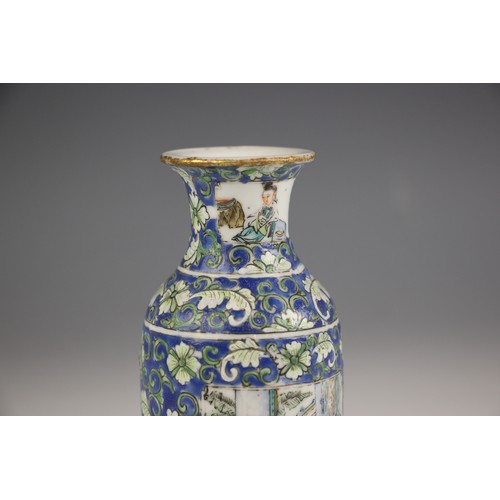 573 - A Chinese porcelain rouleau vase, 19th century, decorated with floral sprays against a blue ground a... 