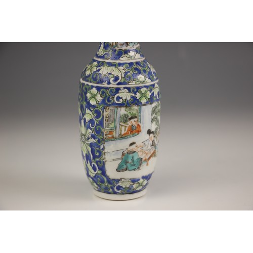 573 - A Chinese porcelain rouleau vase, 19th century, decorated with floral sprays against a blue ground a... 