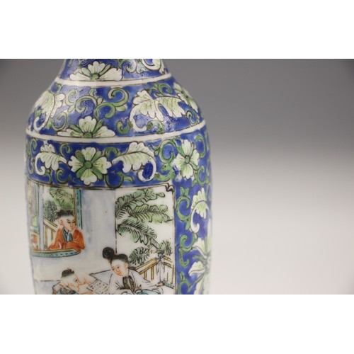 573 - A Chinese porcelain rouleau vase, 19th century, decorated with floral sprays against a blue ground a... 