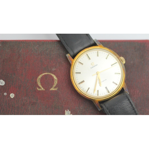 122 - An Omega Geneve gold plated wristwatch, the circular white dial with baton markers, set to a plain p... 