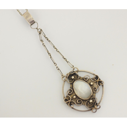 143 - An Arts and Crafts style pendant, the organic shaped untested pearl within an openwork silver colour... 