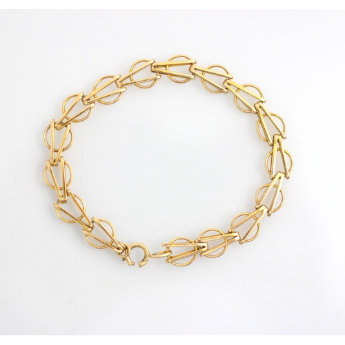 148 - A 9ct yellow gold bracelet, the circular links with arrow head shaped detail to centre, stamped '9.3... 