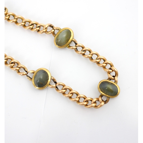 149 - An early 20th century yellow metal bracelet, the curb link bracelet later set with three cabochon ch... 