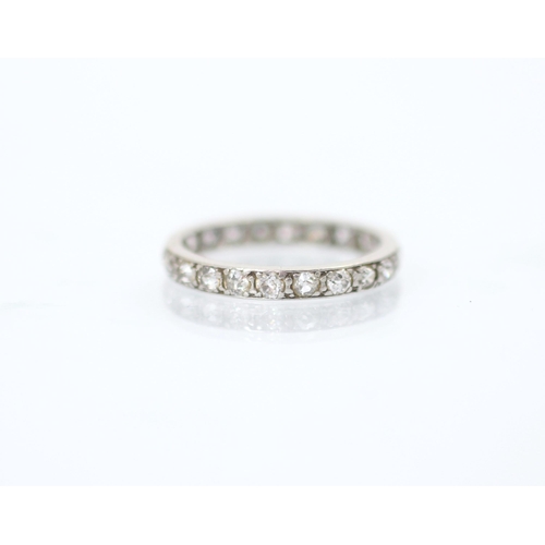 152 - An early 20th century diamond full eternity ring, the twenty two mixed cut diamonds set in white met... 