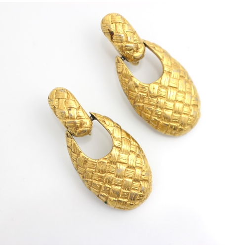 158 - A pair of Givenchy clip on earrings, the gold coloured oval drops with engraved cross hatch detail s... 