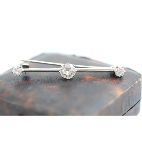 160 - A 20th century diamond set bar brooch, the central old cut diamond within white metal claw set setti... 