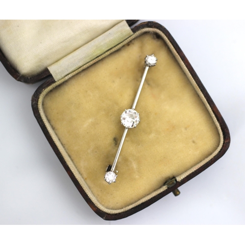 160 - A 20th century diamond set bar brooch, the central old cut diamond within white metal claw set setti... 